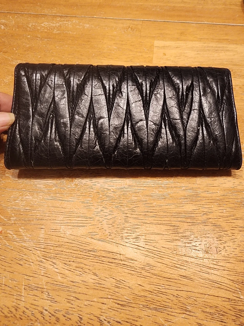 black quilted leather Miu Miu Matelassé long bifold wallet gold-tone Logo
